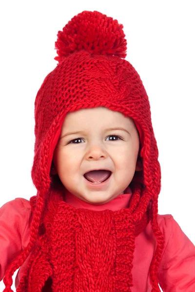 Baby girl with a funny wool red hat — Stock Photo, Image