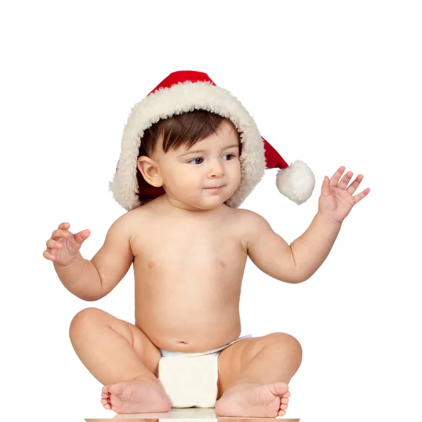 Baby girl with a red Christmas hat Stock Picture