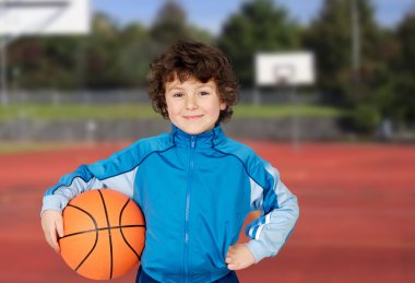 Adorable child playing the basketball clipart
