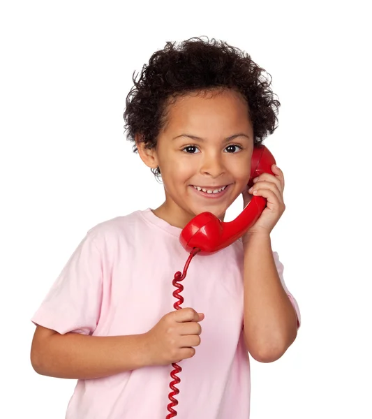 Латинский ребенок с красным телефоном — стоковое фото