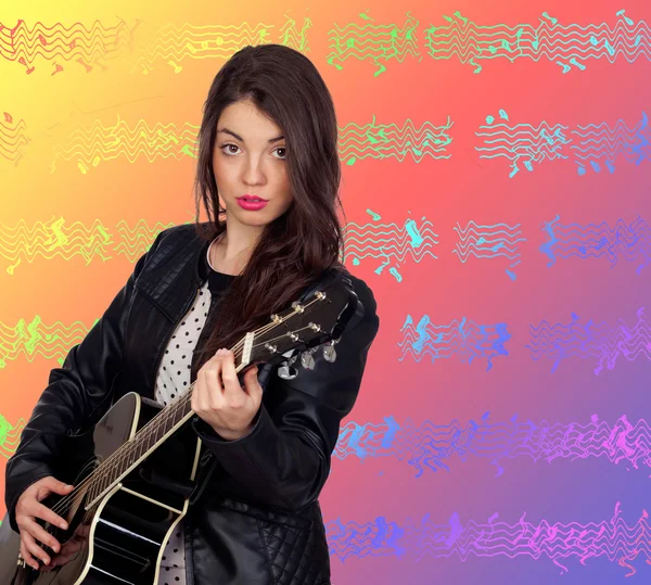 Pretty brunette girl with a guitar — Stock Photo, Image