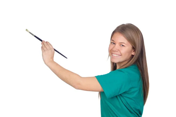 Menina adolescente pintando algo com um pincel — Fotografia de Stock