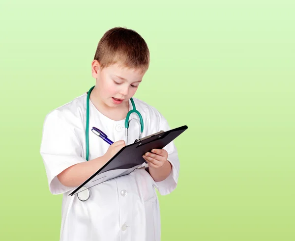 Criança engraçada com uniforme médico — Fotografia de Stock