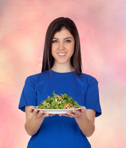 Teenager girl eating vegetables — Stock Photo, Image