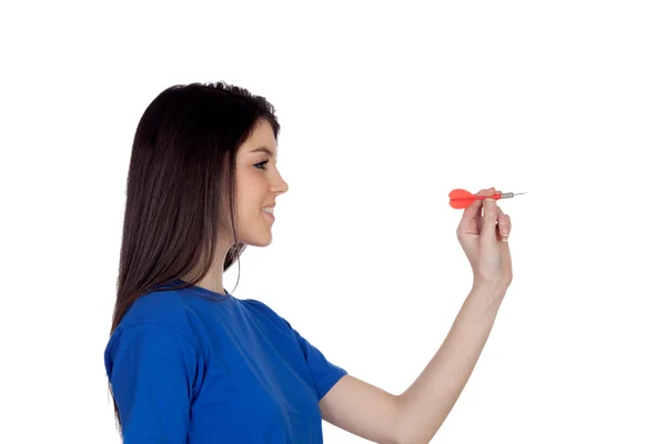 Attractive girl smiling throwing a dart — Stock Photo, Image