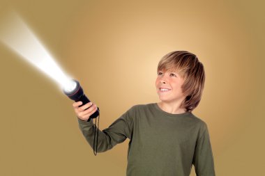 Child with a flashlight looking for something clipart