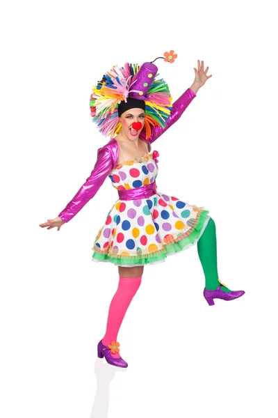 Funny girl clown with a big colorful wig dancing — Stock Photo, Image