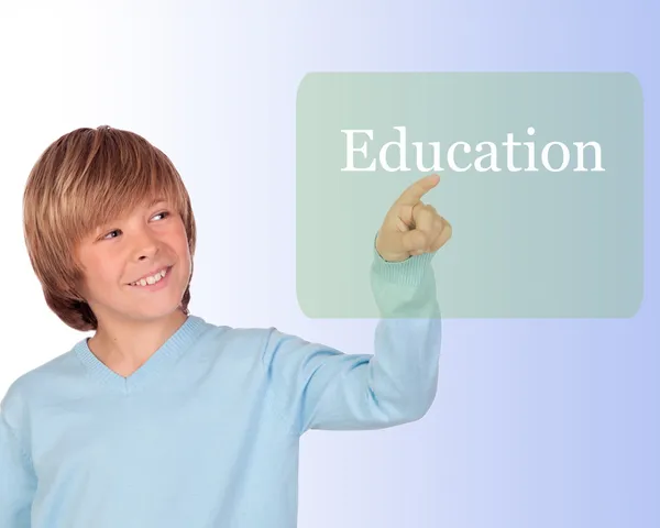 Happy preteen boy pointing the word Education — Stock Photo, Image