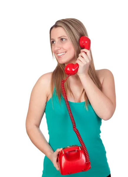 Приваблива брюнетка дівчина дзвонить з червоним телефоном — стокове фото