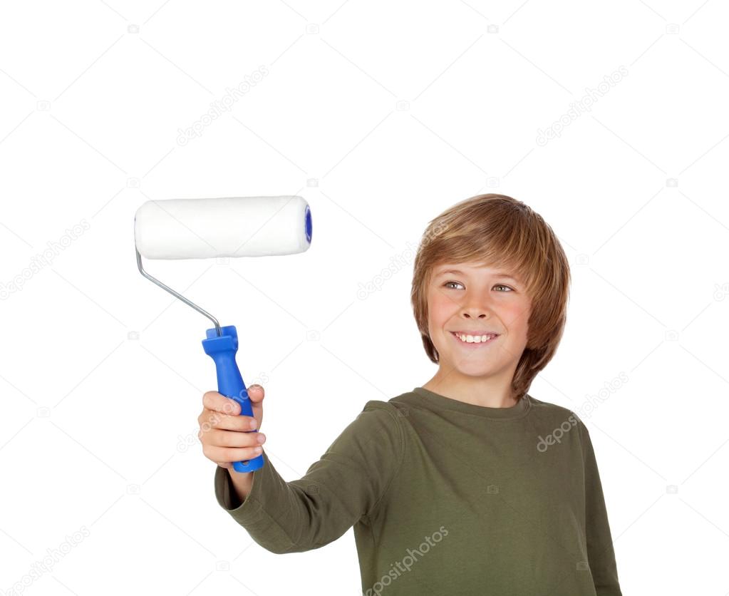 Adorable child with a paint roller