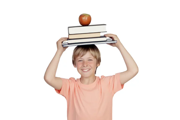 Glimlachend jongen met boeken en een apple oh zijn hoofd — Stockfoto