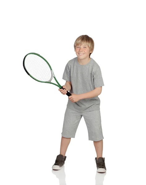 Preteen playing tennis holding racket Stock Image