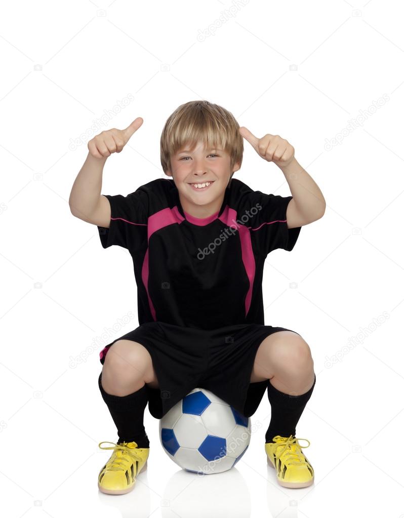 サッカー ボールと言って上に座っての制服のプレティーン ストック写真 C Gelpi