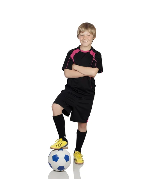 Preadolescente con un uniforme para jugar al fútbol pisando la pelota — Foto de Stock