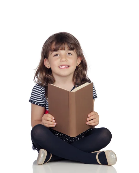 Bedårande liten flicka med en bok reading — Stockfoto