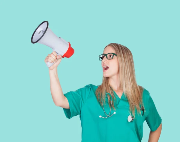 Atractive medical girl with a megaphone — Stock Photo, Image