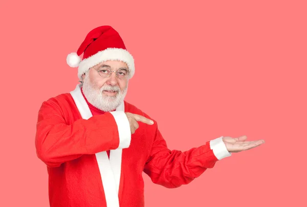 Papai Noel apontando algo com o dedo — Fotografia de Stock