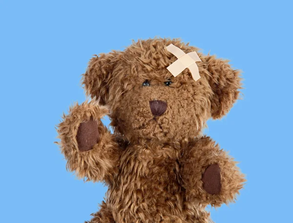 Nice teddybear with a band-air — Stock Photo, Image
