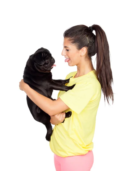 Brunette girl with her pug dog — Stock Photo, Image