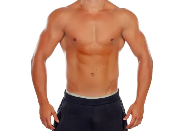 Bonito jovem sem camisa com músculos definidos e um piercing — Fotografia de Stock
