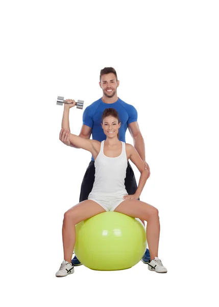 Attractive woman and a personal trainer — Stock Photo, Image