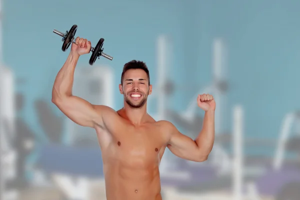 Muscled guy lifting weights — Stock Photo, Image