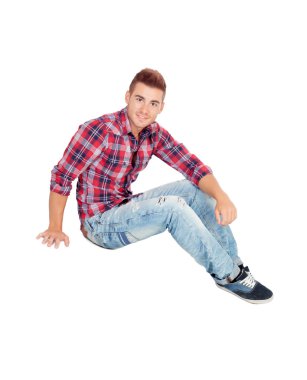 Casual boy sitting on the floor