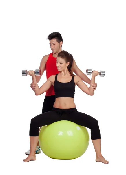 Donna attraente e un personal trainer — Foto Stock