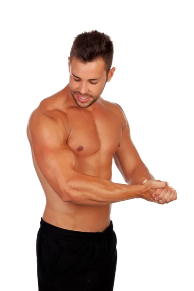 Strong man showing his muscles — Stock Photo, Image