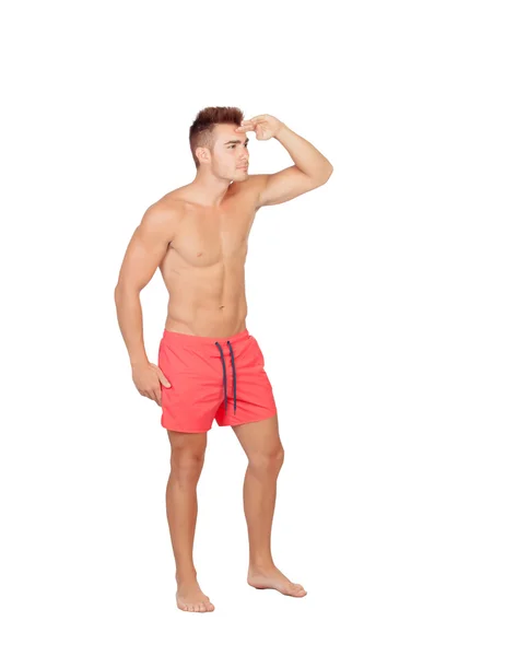 Handsome lifeguard with red swimsuit — Stock Photo, Image