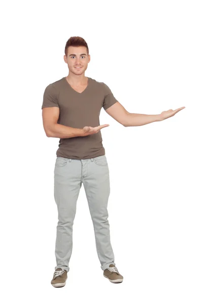 Young smiling man shows something — Stock Photo, Image