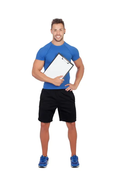 Handsome personal trainer with a clipboard — Stock fotografie