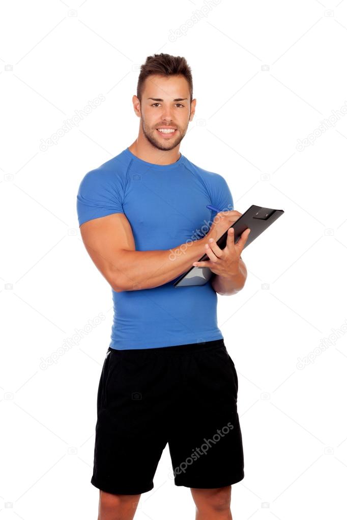Handsome personal trainer with a clipboard