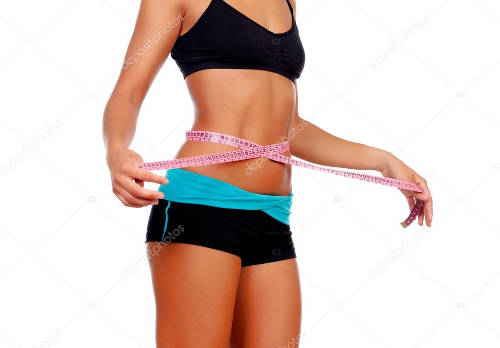 Slim brunette girl with tape measure and fitness clothes