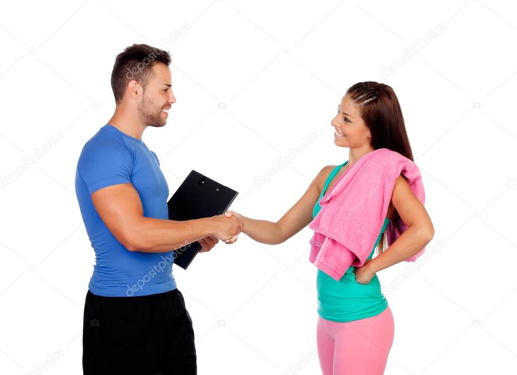 Handsome personal trainer with a attractive girl
