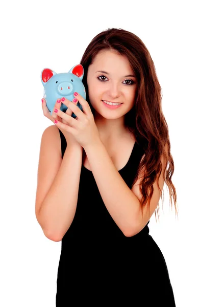 Pretty teen girl with a blue piggy-bank — Stock Photo, Image