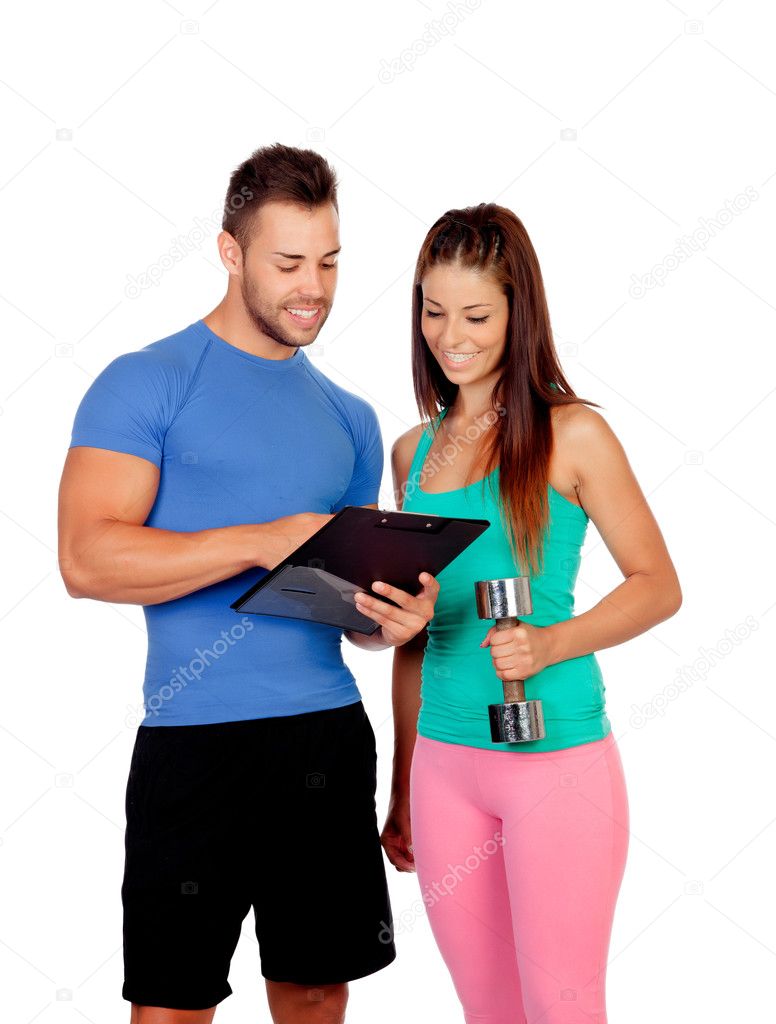 Handsome personal trainer with a attractive girl