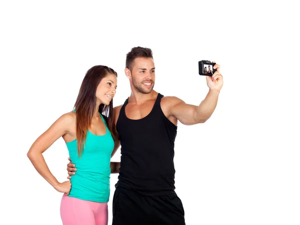 Attractive young couple by becoming a photo — Stock Photo, Image