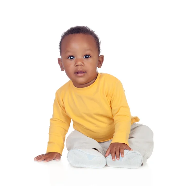 Adorable african baby sitting on the floor — Stock Photo, Image