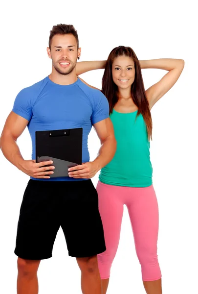 Bello personal trainer con una ragazza attraente — Foto Stock