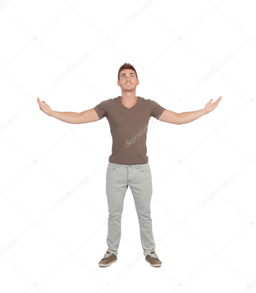Casual young man looking up with arms extended