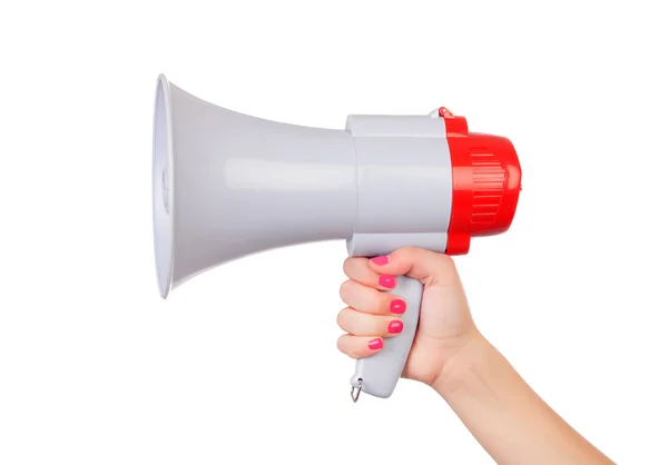 Female hand with pink nails holding a megaphone — Stock Photo, Image