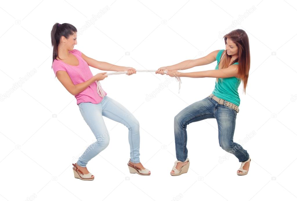 Two beautiful women pulling a rope