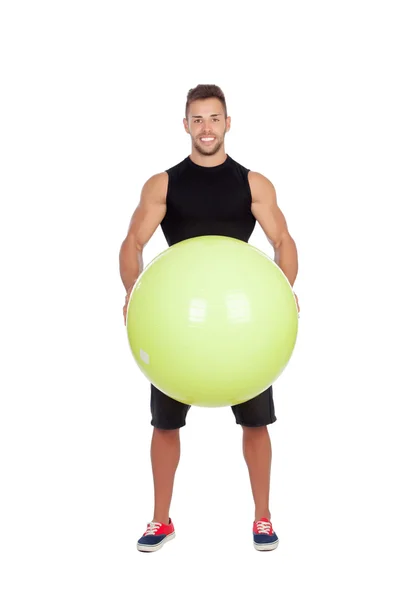 Vonzó férfi, egy nagy labdát a pilates — Stock Fotó