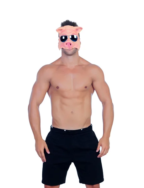 Muskulös man med en pig mask — Stockfoto