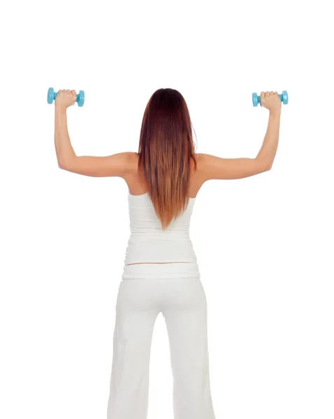 Attractive girl back in white toning her muscles — Stock Photo, Image