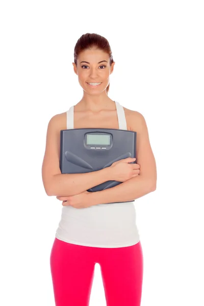 Slim woman with a scale in his arms — Stock Photo, Image