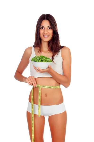 Menina de roupa interior branca com uma salada e fita métrica — Fotografia de Stock