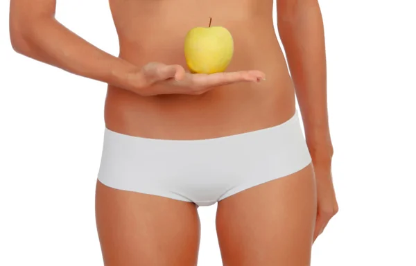 Chica en ropa interior blanca con una manzana —  Fotos de Stock