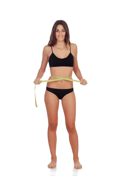 Girl in black underwear with tape measure — Stock Photo, Image